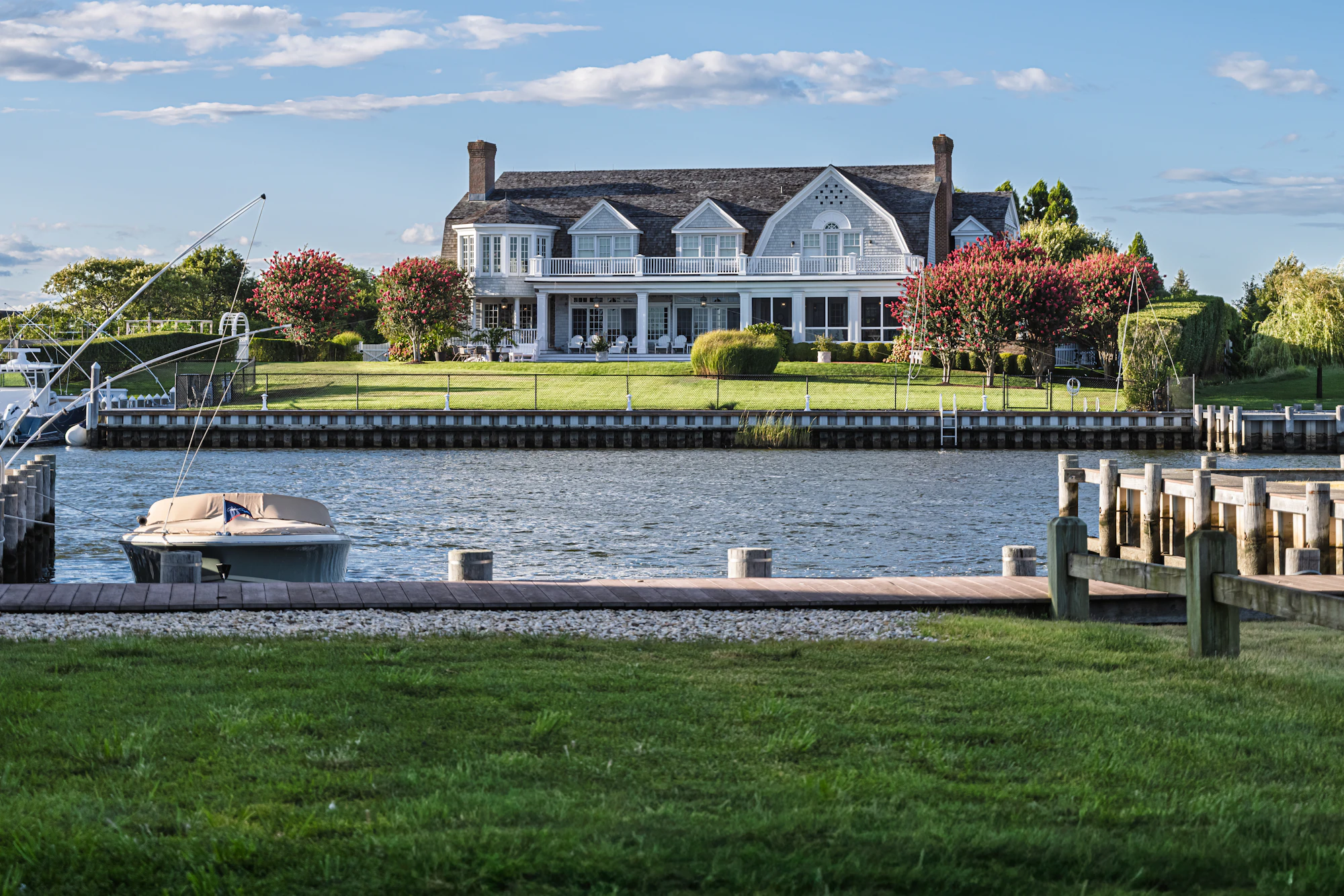 Waterfront house with a private dock and moored boat